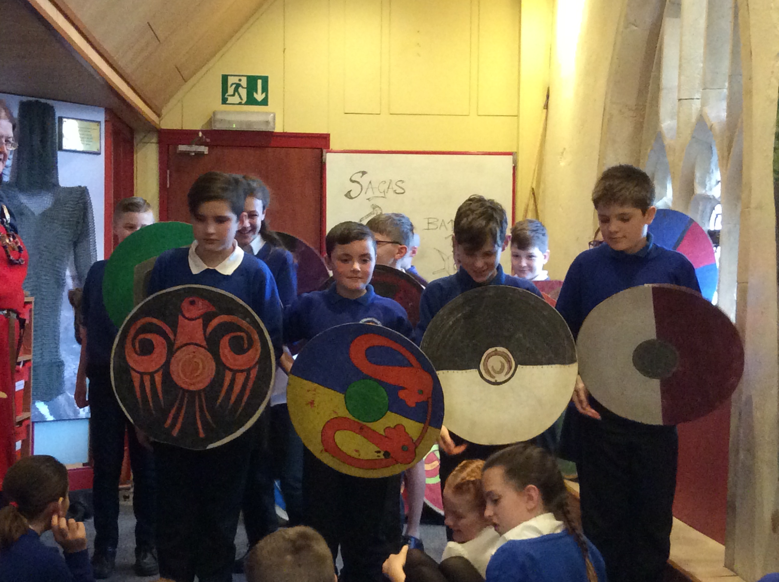 Children holding Viking shields